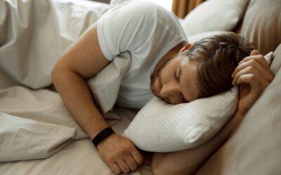 man sleeping and considering the connection between sleep and mental health